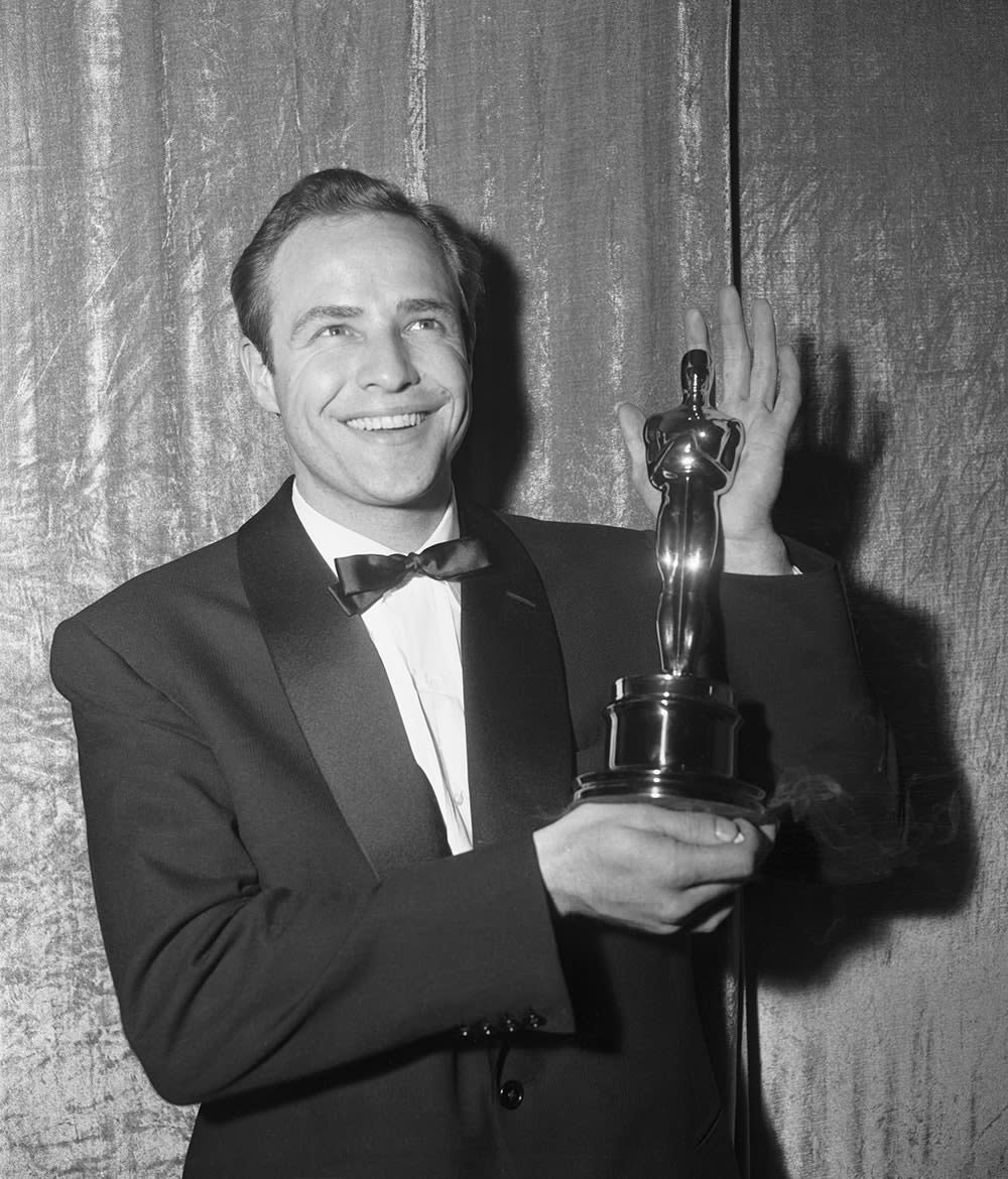 Marlon Brando holding an Oscar