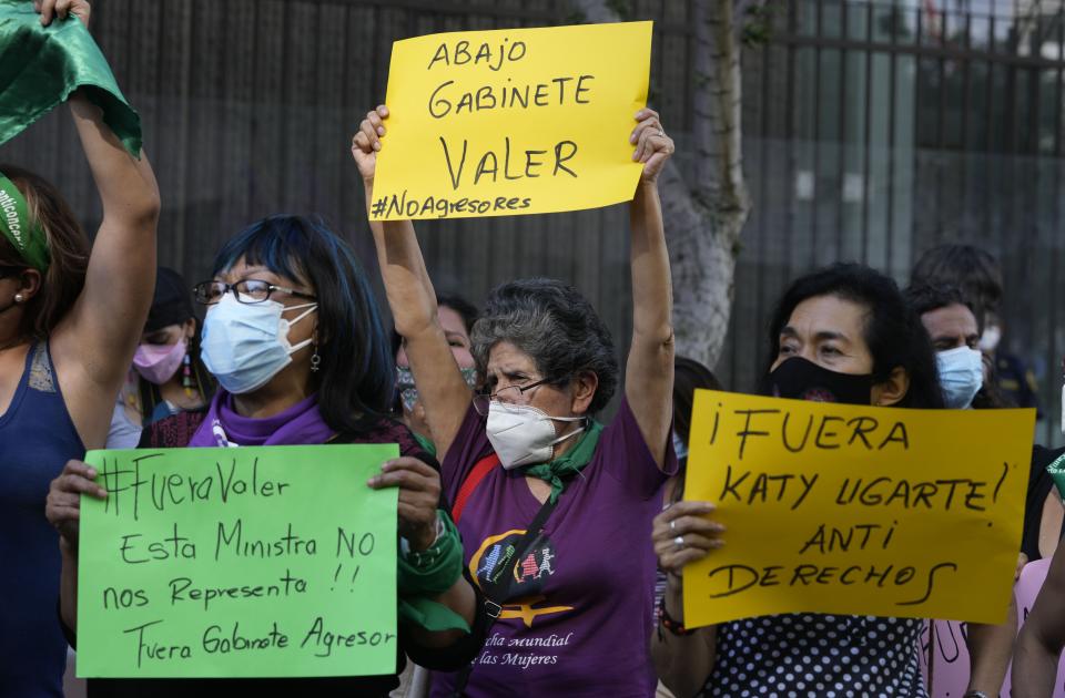 Feminist groups protest against what they call a "machista" and corrupt Cabinet of Peru’s President Pedro Castillo, outside the Ministry of Women, in Lima, Peru, Friday, Feb. 4, 2022. The women called out Peru’s newly appointed prime minister Hector Valer, head of the Cabinet, who has been accused of domestic violence against his wife and daughter. Valer has denied the accusations. (AP Photo/Martin Mejia)