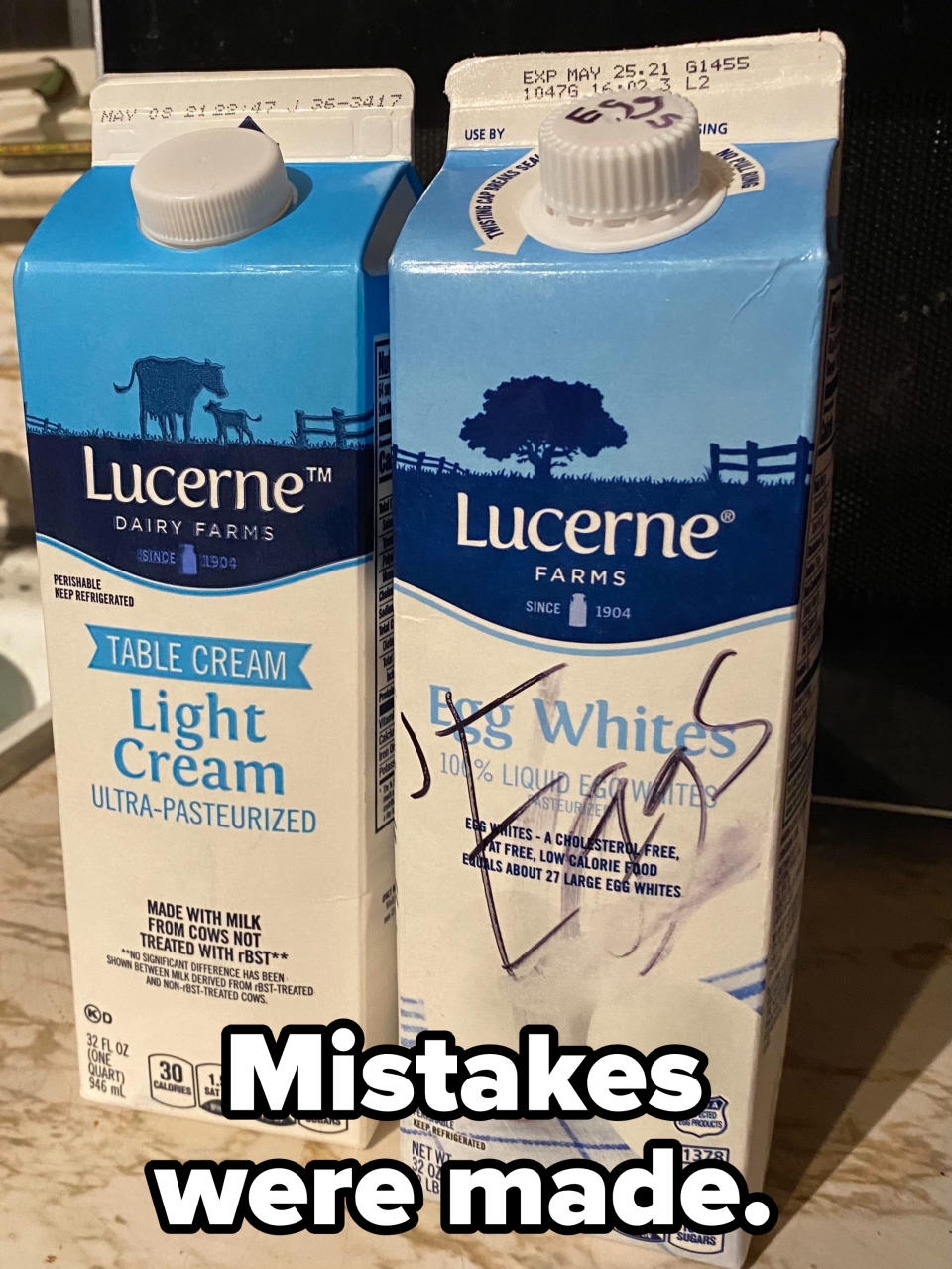 Two cartons from Lucerne Dairy Farms: one of light cream on the left and one of egg whites on the right