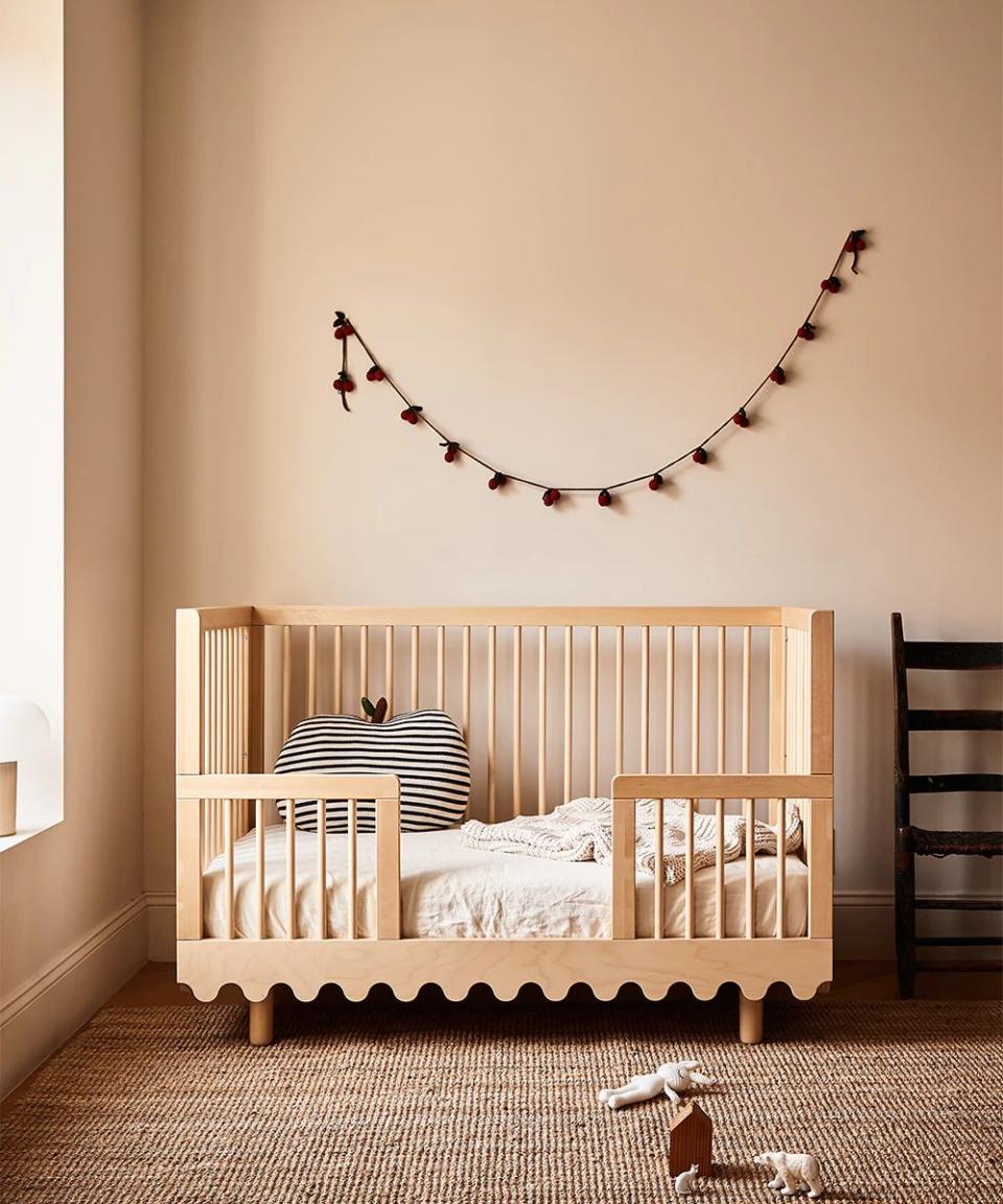 a baby crib with a reindeer head