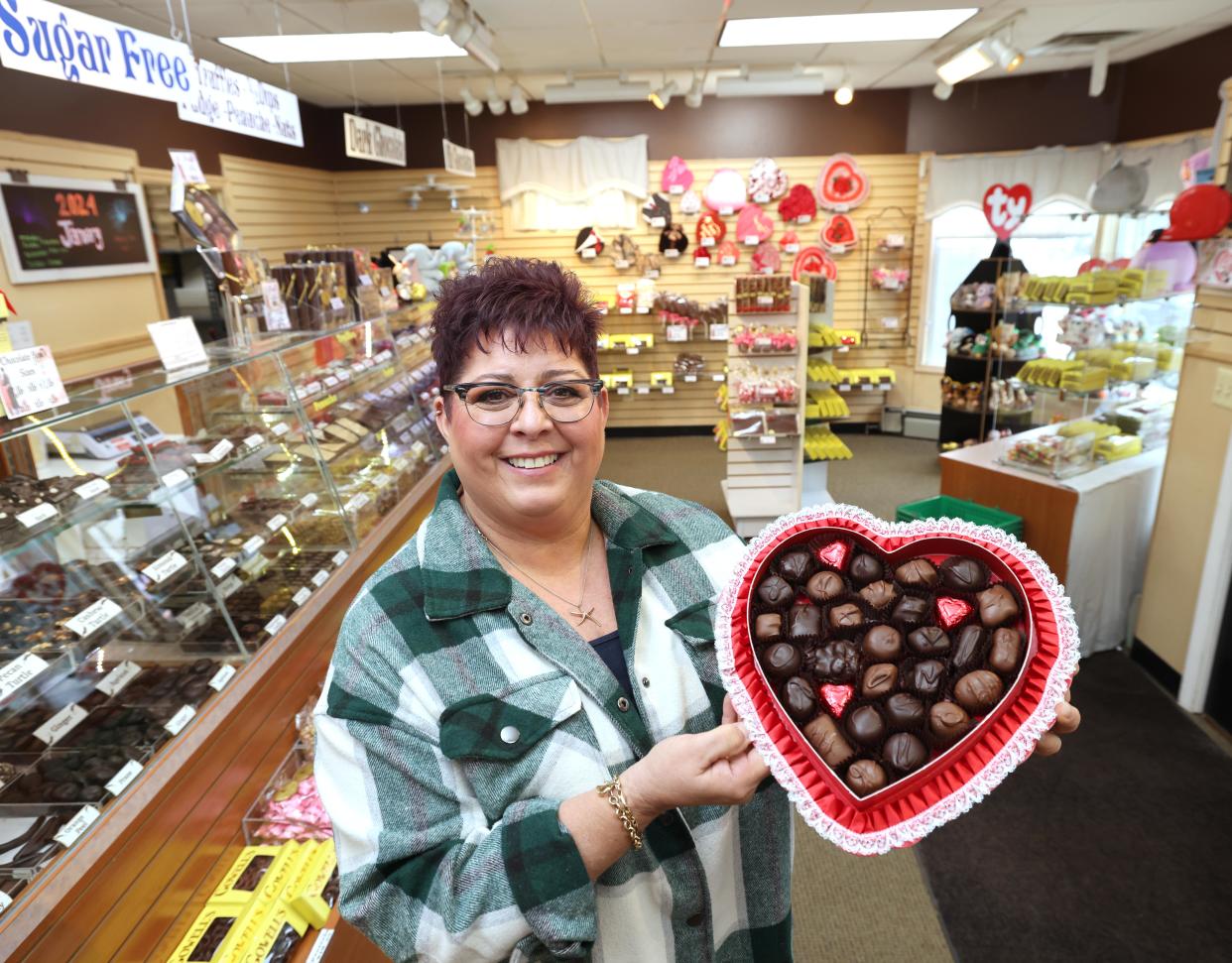 Owner Lori Gowell holds a heart shaped box of candy at Gowell's Home Made Candy, 727 North Main Street in Brockton on Tuesday, Jan. 23, 2024.