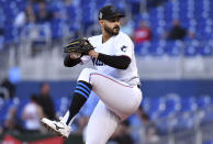 Miami Marlins pitcher Pablo Lopez winds up during the first inning of the team's baseball game against the Milwaukee Brewers, Friday, May 13, 2022, in Miami. (AP Photo/Jim Rassol)