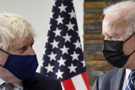U.S. President Joe Biden, right, talks with Britain's Prime Minister Boris Johnson, during their meeting ahead of the G7 summit in Cornwall, Britain, Thursday June 10, 2021. (Toby Melville/Pool Photo via AP)