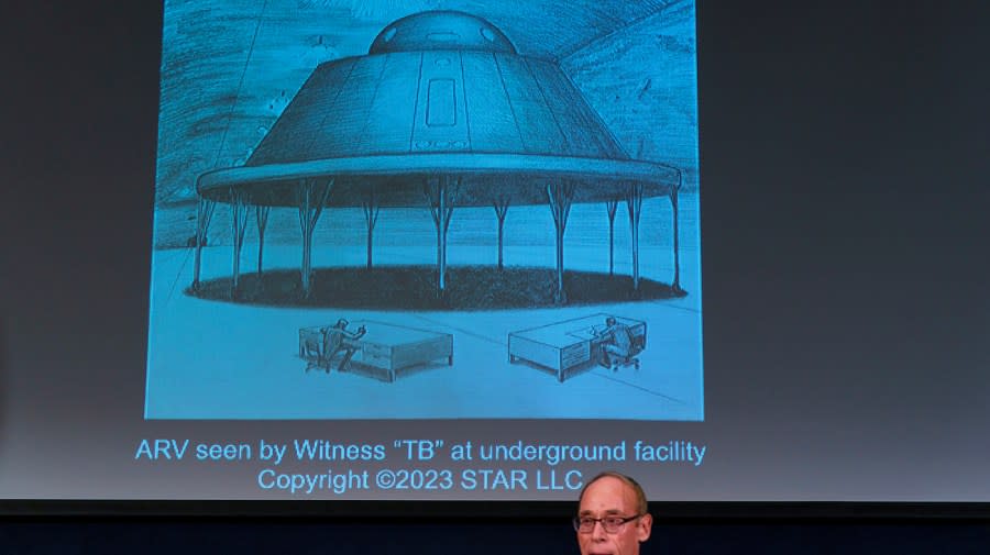 Dr. Steven Greer ufologist and founder of The Disclosure Project show an illustration from witness testimony