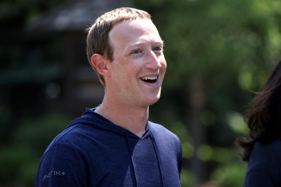 Mark Zuckerberg smiles while walking outside at 2021 Sun Valley conference