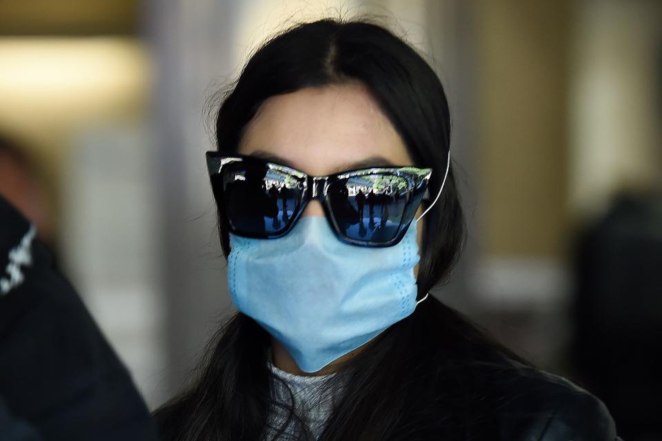 A passenger wears a protective mask at Mexico City's international airport, on February 28, 2020. - Mexico's Health Ministry confirmed the country's first case of coronavirus on Friday, saying a young man had tested positive for it in the capital. (Photo by Alfredo ESTRELLA / AFP) (Photo by ALFREDO ESTRELLA/AFP via Getty Images)