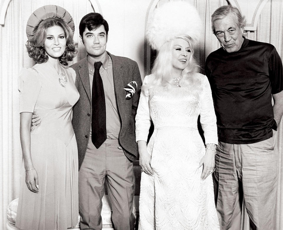 The four stars of 1970’s Myra Breckinridge, from left: Raquel Welch, Rex Reed, Mae West and John Huston. The film, based on a story by Gore Vidal, was West’s first screen appearance in 27 years. - Credit: 20th Century Fox/Courtesy Everett Collection