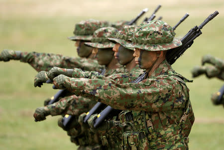 Soldiers of Japanese Ground Self-Defense Force (JGSDF)'s Amphibious Rapid Deployment Brigade, Japan's first marine unit since World War Two, march at a ceremony activating the brigade at JGSDF's Camp Ainoura in Sasebo, on the southwest island of Kyushu, Japan April 7, 2018. REUTERS/Issei Kato