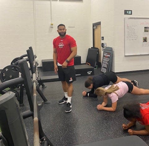 Durfee's Cabrinni Goncalves watches the kids work out at the fitness center inside the Luke Urban Field House.