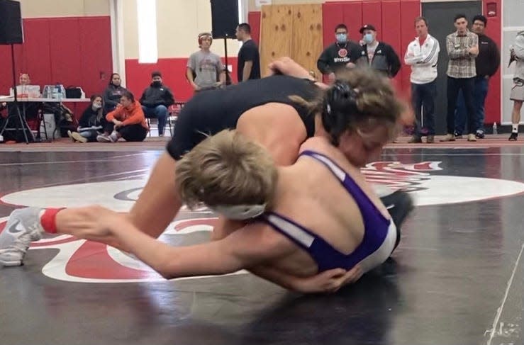 Freeport's Cadence Diduch tries to roll over one of her opponents during a run to the championship at 120 pounds at the Rockford East Giardini Invitational on Saturday, Dec. 4, 2021.