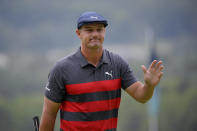 Bryson DeChambeau reacts after missing his putt on the ninth green during the final round of the BMW Championship golf tournament, Sunday, Aug. 29, 2021, at Caves Valley Golf Club in Owings Mills, Md. (AP Photo/Nick Wass)