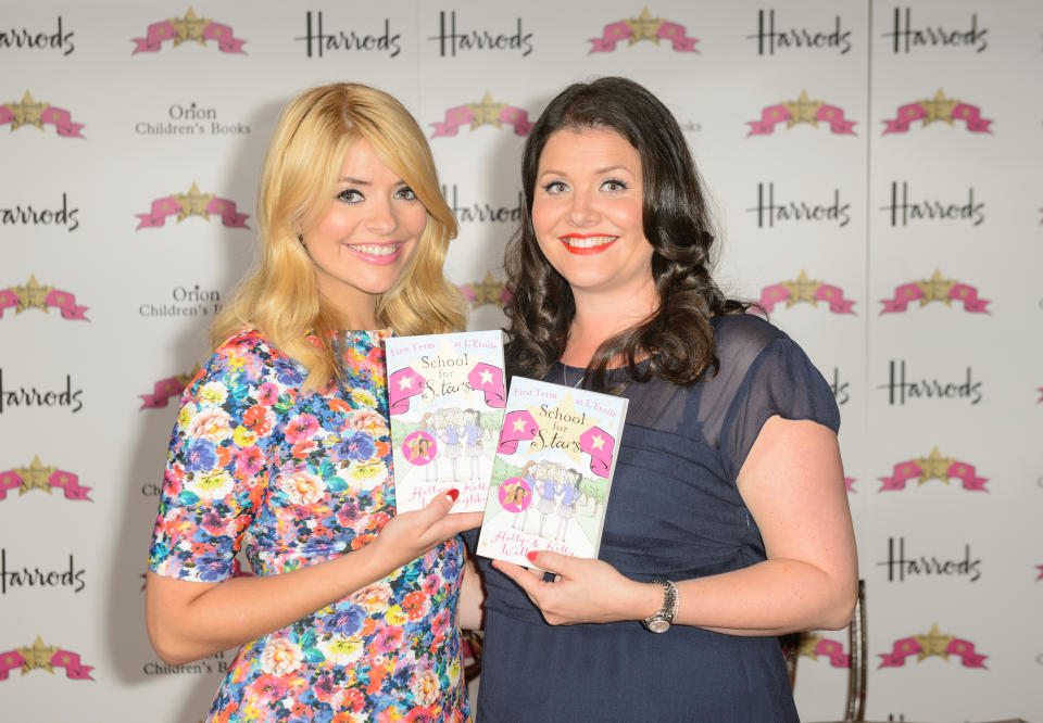 Holly Willoughby and her sister Kelly Willoughby at a signing session for their book 'School for Stars', at Harrods, in west London.   (Photo by Dominic Lipinski/PA Images via Getty Images)