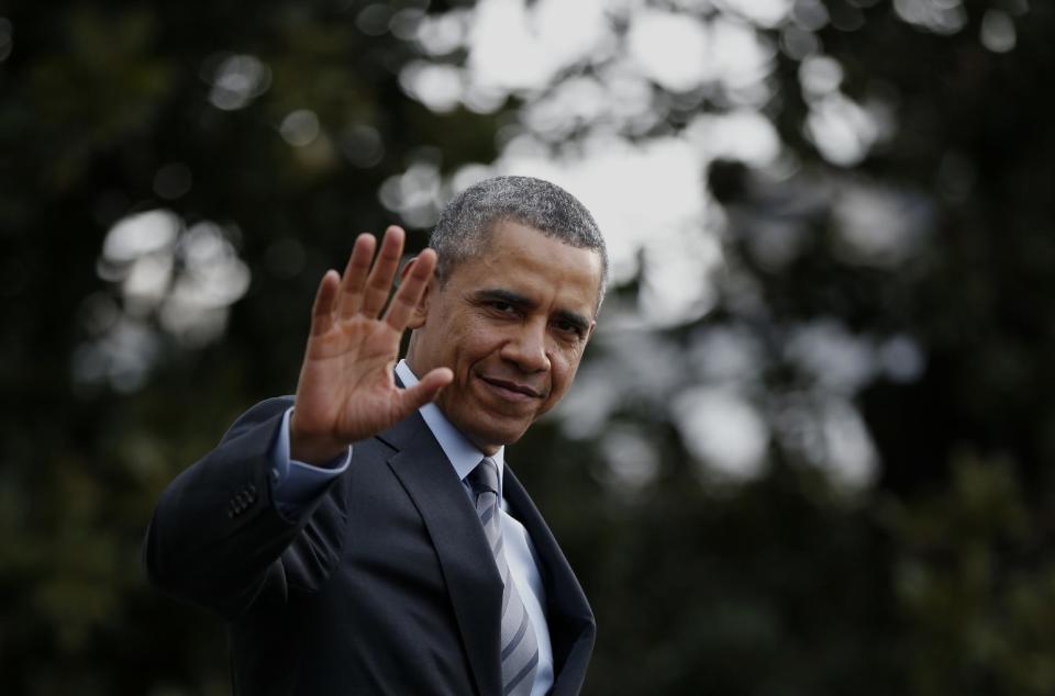 President Barack Obama waves to reporters as he walks on the South Lawn of the White House in Washington, Wednesday, Feb. 19, 2014, before boarding the Marine One helicopter to Andrews Air Force Base, Md., for his trip to Mexico. (AP Photo/Charles Dharapak)