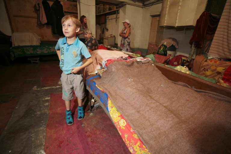 Sasha, 10, stands in a bomb shelter in Donetsk, eastern Ukraine