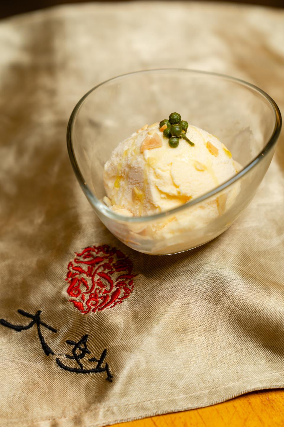 Ice cream, with a dash of mala oil and garnished with almonds and Sichuan peppercorns. (PHOTO: Da Miao Hot Pot) 