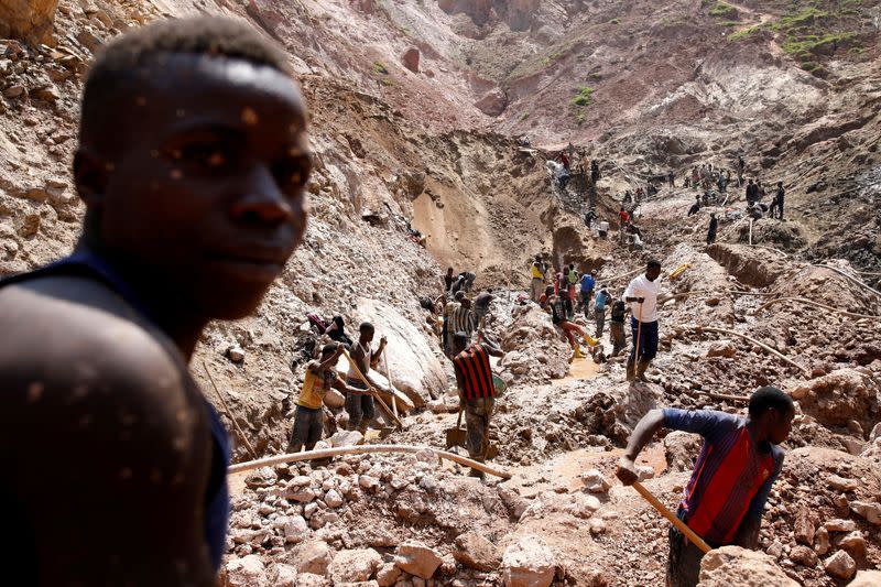 FILE PHOTO: Labourers work at an open shaft of the SMB coltan mine near the town of Rubaya
