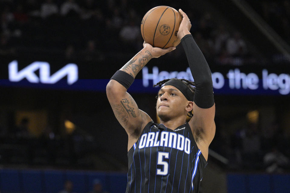 Orlando Magic forward Paolo Banchero (5) goes up for a shot during the first half of an NBA basketball game against the Charlotte Hornets, Friday, Oct. 28, 2022, in Orlando, Fla. (AP Photo/Phelan M. Ebenhack)