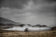 <p>Brutal winds whip spray from the sea over a coastal cottage in Loch Stack, Scotland. (Dougie Cunningham)</p>