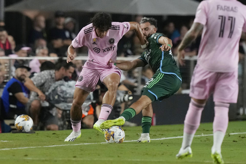 New York City forward Kevin O'Toole (22) defends Inter Miami midfielder David Ruiz (41) during the first half of an MLS soccer match, Saturday, Sept. 30, 2023, in Fort Lauderdale, Fla. (AP Photo/Marta Lavandier)