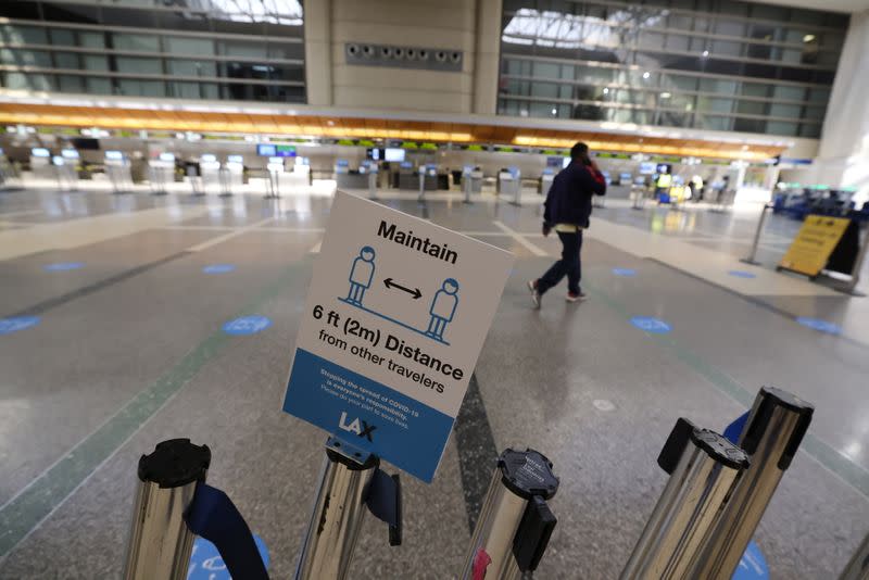 A man walks through Tom Bradley international terminal at LAX airport, as the global outbreak of the coronavirus disease (COVID-19) continues, in Los Angeles