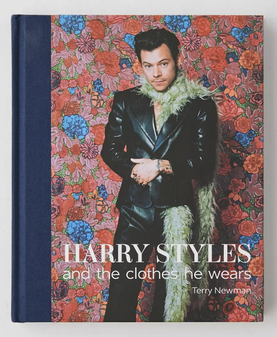 blue and pink book with photo of Harry Styles