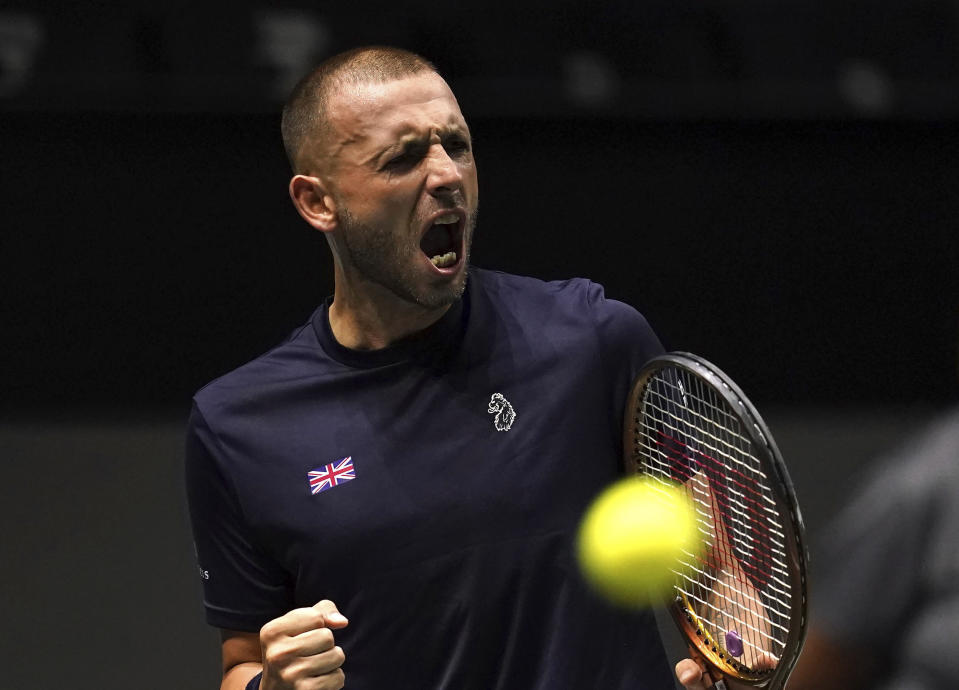 Britain's Daniel Evans celebrates a point against Australia's Alex de Minaur during the Davis Cup group stage tennis match at the AO Arena, Manchester, England, Wednesday, Sept. 13. 2023. (Martin Rickett/PA via AP)