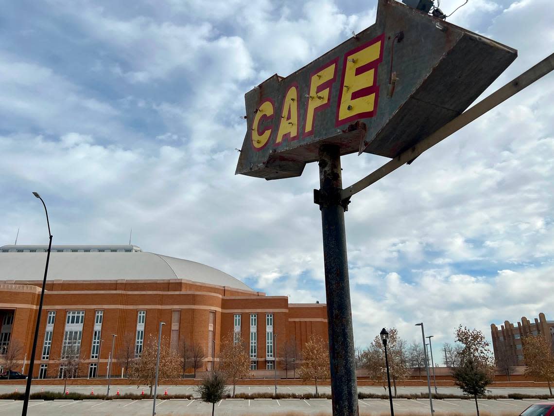 The old-timey neon “cafe” arrow points to Montgomery Street Cafe across from Dickies Arena, Jan. 7, 2023.