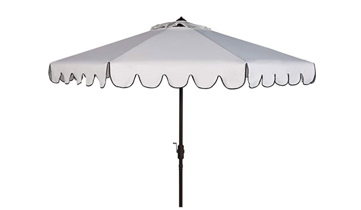 White umbrella with black scalloped trim