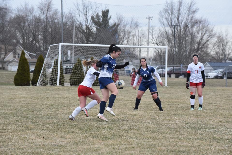 Adrian's Eden Palmani looks to pass the ball ahead during Tuesday's game against Coldwater.