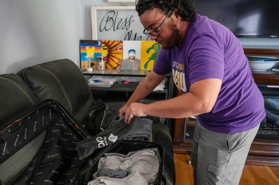 Mel Vezina packs for the upcoming week of work at the California School for the Deaf in Fremont. They have commuted there for work from the Sacramento region for over 10 years. They said sleeping in their vehicle is starting to take an emotional and physical toll on them.