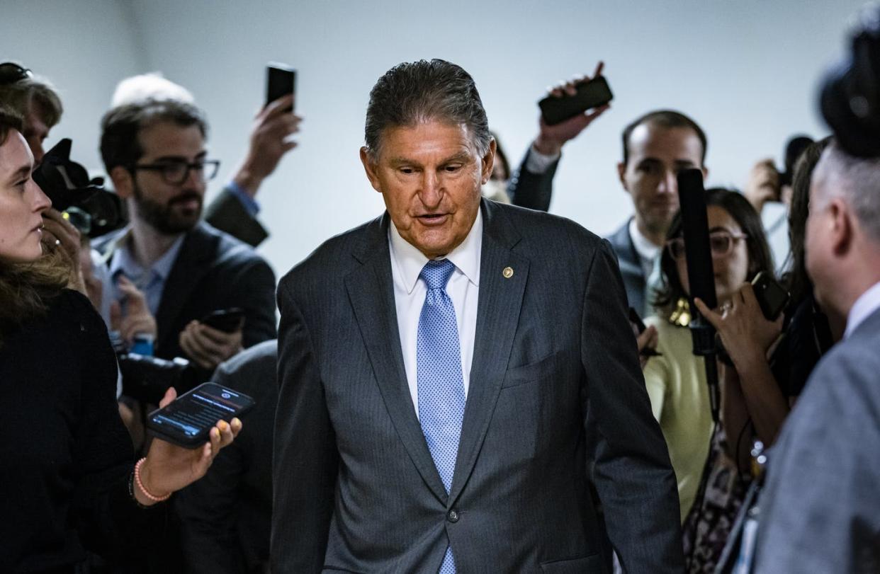 <span class="caption">Sen. <span class="caas-xray-inline-tooltip"><span class="caas-xray-inline caas-xray-entity caas-xray-pill rapid-nonanchor-lt" data-entity-id="Joe_Manchin" data-ylk="cid:Joe_Manchin;pos:1;elmt:wiki;sec:pill-inline-entity;elm:pill-inline-text;itc:1;cat:OfficeHolder;" tabindex="0" aria-haspopup="dialog"><a href="https://search.yahoo.com/search?p=Joe%20Manchin" data-i13n="cid:Joe_Manchin;pos:1;elmt:wiki;sec:pill-inline-entity;elm:pill-inline-text;itc:1;cat:OfficeHolder;" tabindex="-1" data-ylk="slk:Joe Manchin;cid:Joe_Manchin;pos:1;elmt:wiki;sec:pill-inline-entity;elm:pill-inline-text;itc:1;cat:OfficeHolder;" class="link ">Joe Manchin</a></span></span>, a Democrat from the coal state of West Virginia, is in a powerful position for directing the nation's climate future.</span> <span class="attribution"><a class="link " href="https://www.gettyimages.com/detail/news-photo/senator-joe-manchin-is-surrounded-by-reporters-as-he-heads-news-photo/1233339223?adppopup=true" rel="nofollow noopener" target="_blank" data-ylk="slk:Samuel Corum/Getty Images;elm:context_link;itc:0;sec:content-canvas">Samuel Corum/Getty Images</a></span>