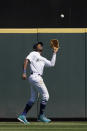 Seattle Mariners center fielder Kyle Lewis catches a fly ball from Los Angeles Dodgers' Will Smith in the fourth inning of a baseball game Tuesday, April 20, 2021, in Seattle. (AP Photo/Ted S. Warren)