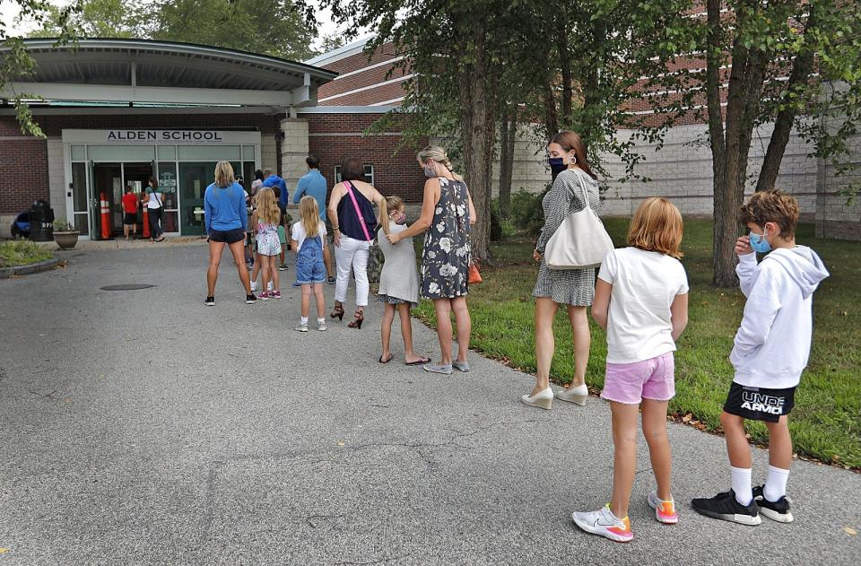 Students and parents line up to tour the Alden School in Duxbury.