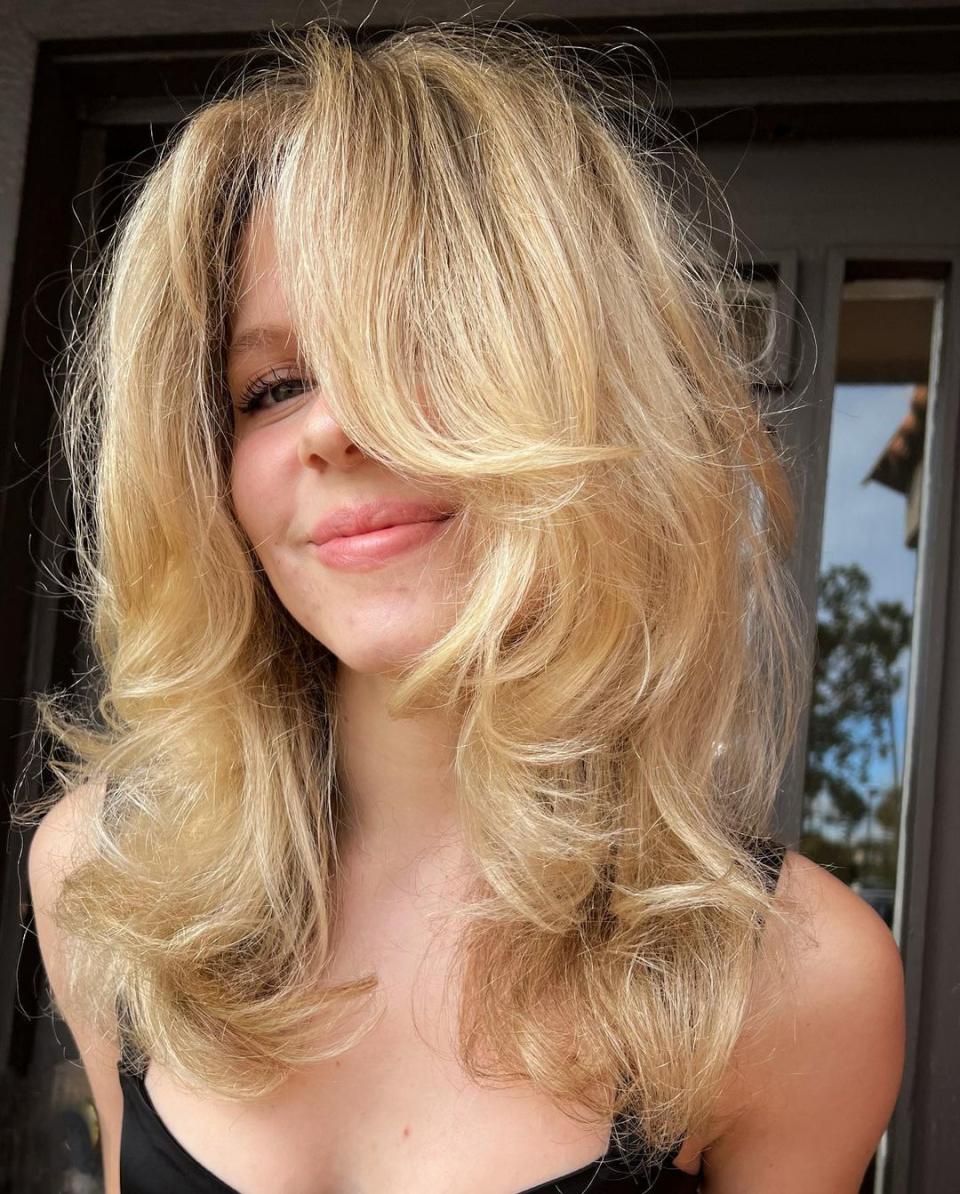 <h1 class="title">Blonde Butterfly Haircut</h1><cite class="credit">Instagram / @modestspotcarrillo</cite>