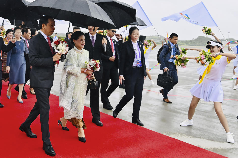 In this photo released by the Press and Media Bureau of the Indonesian Presidential Palace, Indonesian President Joko Widodo, left, and his wife Iriana, second left, are greeted by dancers upon arrival at Chengdu Tianfu International Airport in Chengdu, China, Thursday, July 27, 2023. Indonesian President Joko Widodo arrived Thursday in China and planned to meet with Chinese leader Xi Jinping, a state news agency reported. (Laily Rachev/Indonesian Presidential Palace via AP)