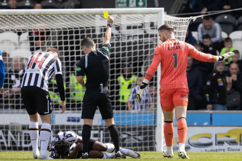 Rangers' Jack Butland was shown a yellow card by referee Nick Walsh -Credit:SNS Group