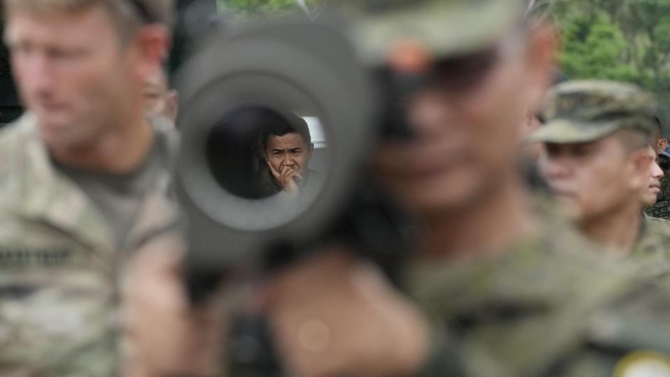 A Filipino soldier is seen through the barrel of a Carl Gustaf recoilless anti-tank rifle during Balikatan on April 13, 2023. (Aaron Favila/AP)