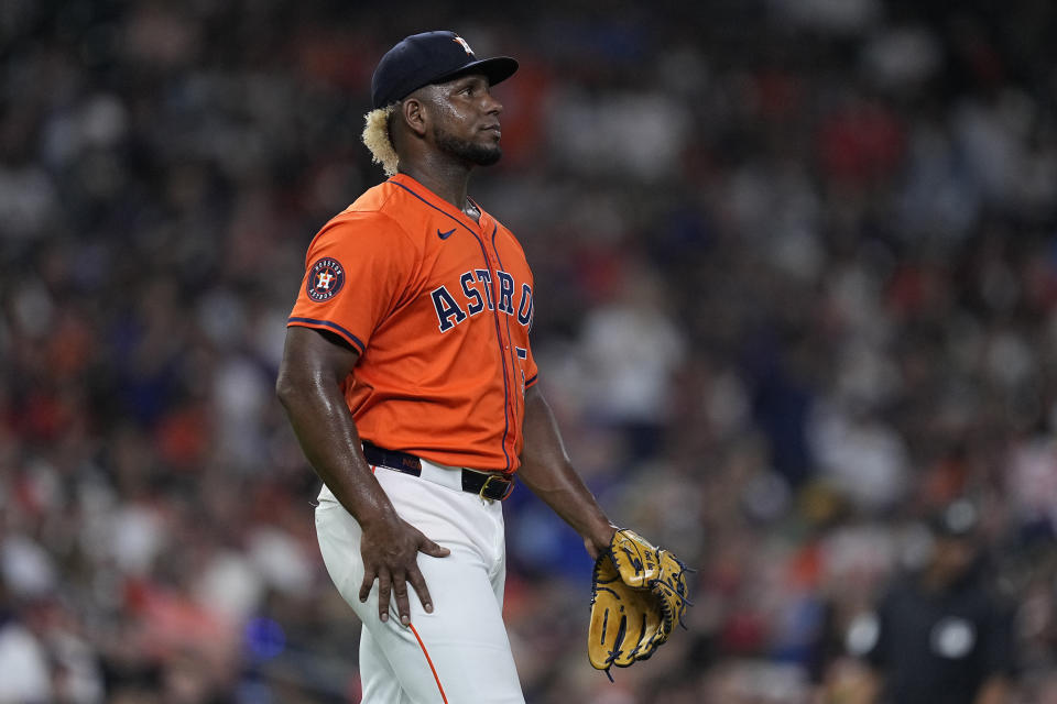 Houston Astros starting pitcher Ronel Blanco walks off the mound after giving up a two-run home run to Seattle Mariners' Dylan Moore during the fifth inning of a baseball game Friday, May 3, 2024, in Houston. (AP Photo/Kevin M. Cox)