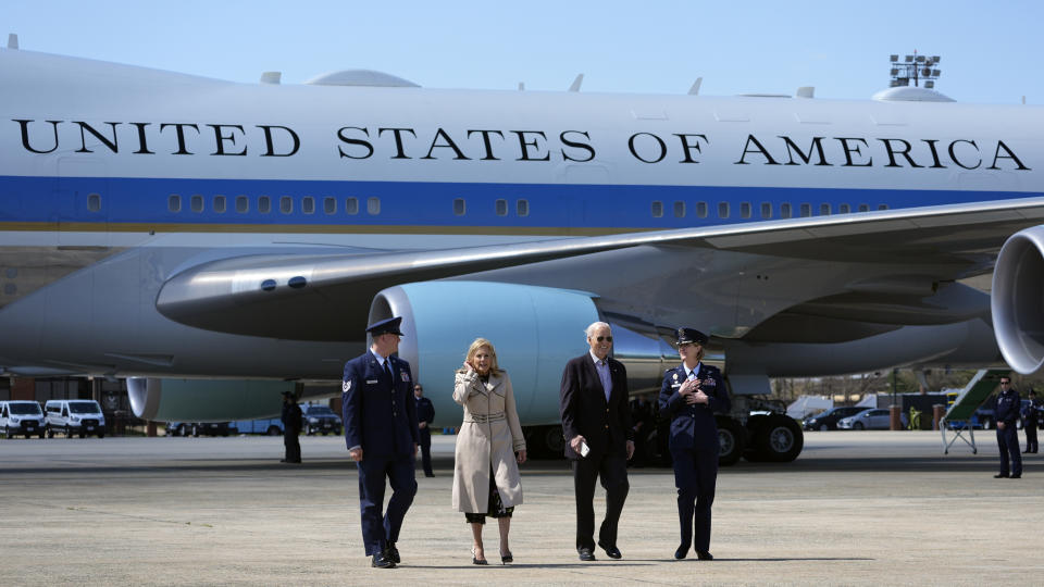 FILE - President Joe Biden, center right, and first lady Jill Biden, center left, walk off Air Force One, March 29, 2024, at Andrews Air Force Base, Md. The White House and the Democratic National Committee are splitting the cost of Biden’s travel while he runs for a second term. It’s part of a longstanding arrangement that prevents taxpayers from being stuck with the full bill for political trips. (AP Photo/Alex Brandon, File)