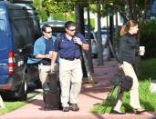 FBI agents prepare to enter the offices of CONCACAF, the soccer federation that governs North America, Central America and the Caribbean, in Miami Beach, Florida May 27, 2015. REUTERS/Gaston De Cardenas