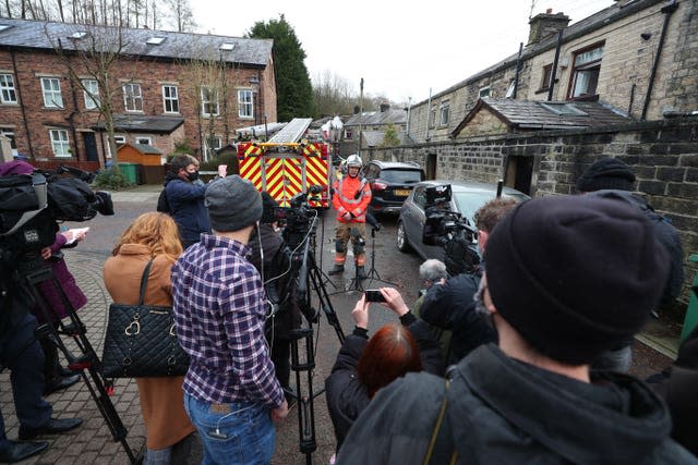 Incident commander, Watch Manager Steve Wilcock, centre, from Greater Manchester Fire and Rescue Service, gives a media briefing in Ramsbottom, Bury, Greater Manchester 