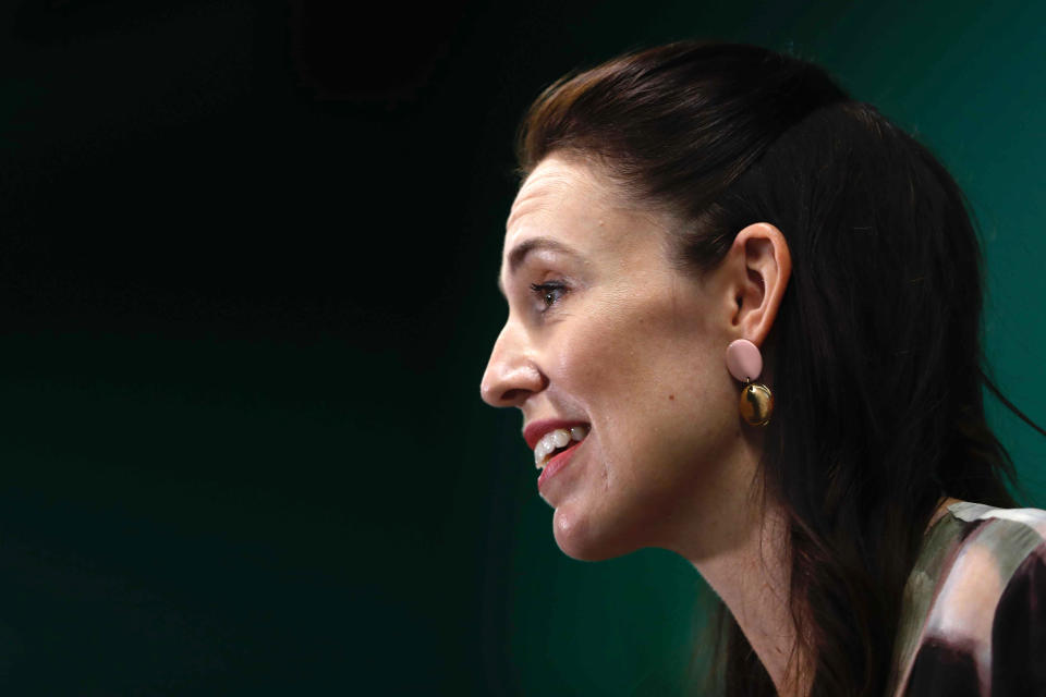 New Zealand Prime Minister Jacinda Ardern outlines the Government's plans, Thursday, Feb. 3, 2022, that will dismantle its quarantine system and reopen its borders to the world. Since the start of the pandemic, New Zealand has enacted some of the world's strictest border controls. (Dean Purcell/New Zealand Herald via AP)