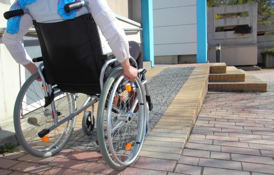 Woman in a wheelchair using a ramp; Shutterstock ID 187933352; Cost Ctr: redownload; Manager: redownload; Email: redownload; Project: redownload