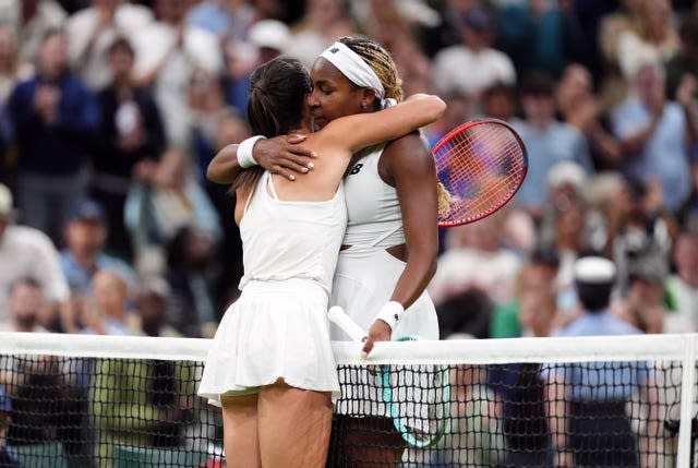 Emma Navarro and Coco Gauff hug at the net