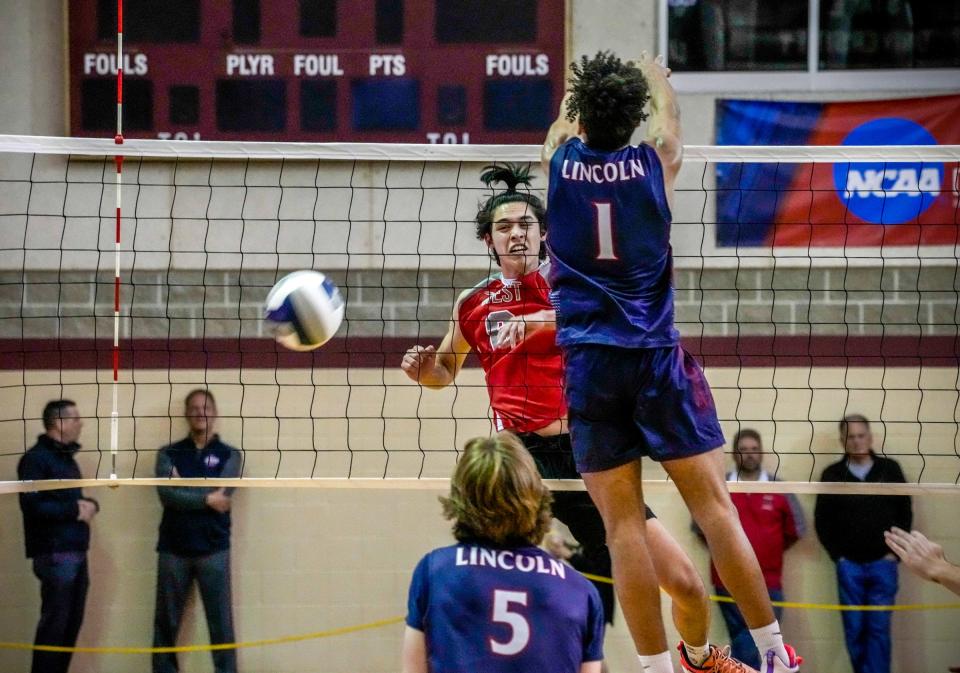 Christian Mak scores for Cranston West. Lincoln volleyball champions