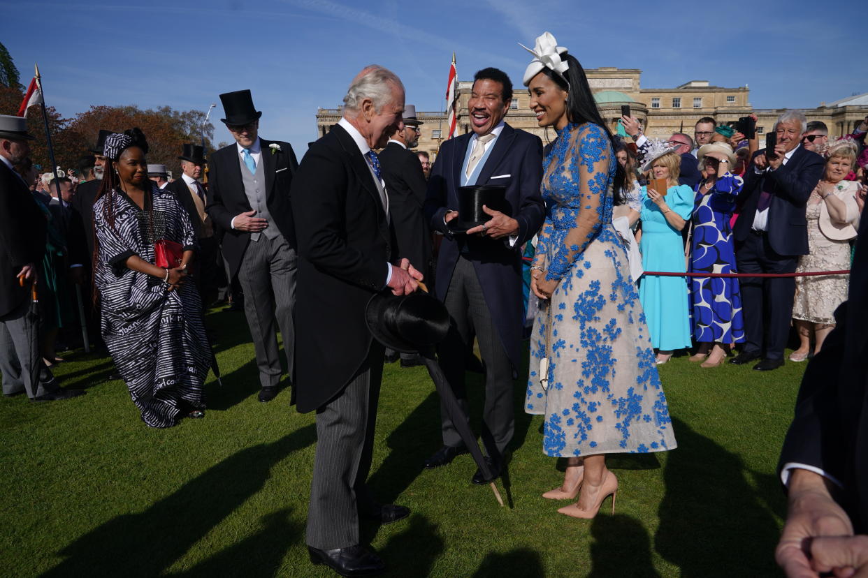 Lionel Richie speaks to King Charles III at a Buckingham Palace garden party.