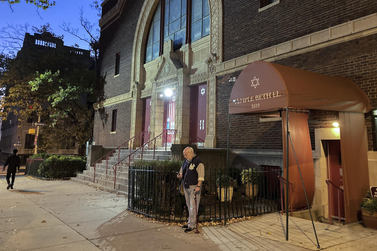 A man stands outside Temple Beth El synagogue, Thursday, Nov. 3, 2022, in Jersey City, N.J. The FBI says it has received credible information about a threat to synagogues in New Jersey. The FBI's Newark office released a statement Thursday afternoon that characterizes it as a broad threat. The statement urged synagogues to "take all security precautions to protect your community and facility."(AP Photo/Ted Shaffrey)