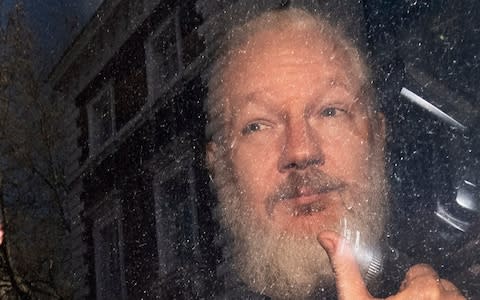 Heavily-bearded Julian Assange pictured on April 11 - Credit: Victoria Jones/PA