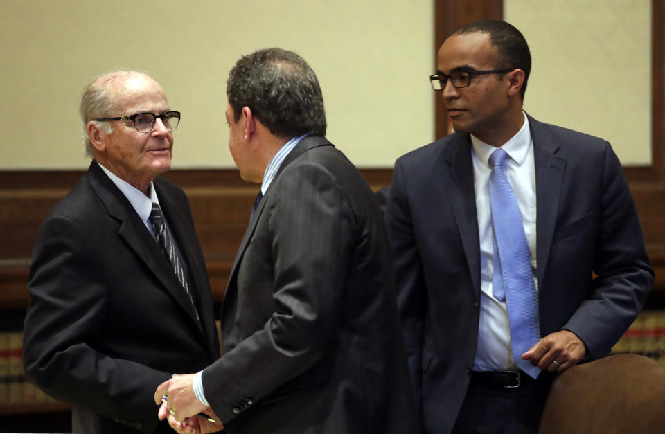 Attorneys for the Legislature Gerry Lee Alexander, left, Paul J. Lawrence, and Nicholas W. Brown stand together following a hearing before the Washington Supreme Court Tuesday, June 11, 2019, in Olympia, Wash. The court heard oral arguments in the case that will determine whether state lawmakers are subject to the same disclosure rules that apply to other elected officials under the voter-approved Public Records Act. The hearing before the high court was an appeal of a case that was sparked by a September 2017 lawsuit filed by a media coalition, led by The Associated Press. (AP Photo/Elaine Thompson)