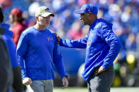 FILE - Buffalo Bills head coach Sean McDermott, left, talks with defensive coordinator Leslie Frazier before an NFL football game against the Washington Football Team on Sept. 26, 2021, in Orchard Park, N.Y. Frazier is credited for providing the Bills a calm and reassuring voice even at the the most troubling times.(AP Photo/Adrian Kraus, File)